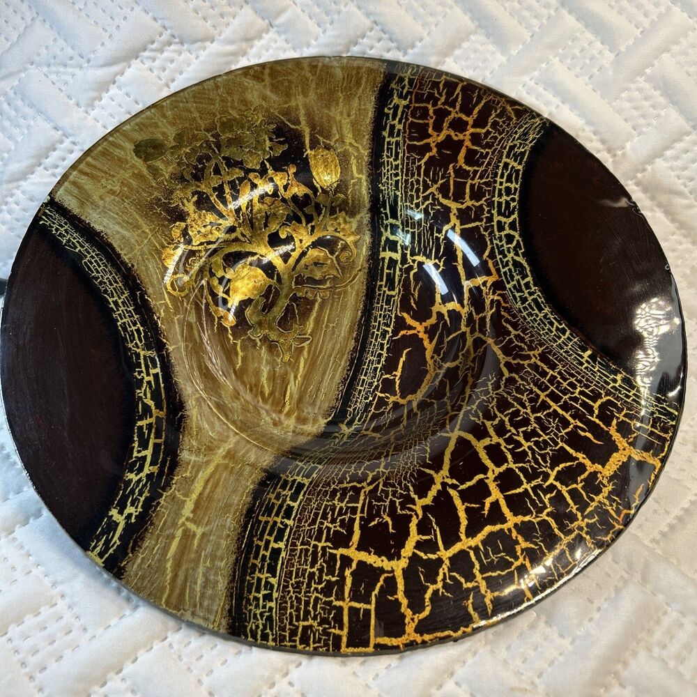 Glass bowl features an asymmetrical shape with a striking black and gold crackle